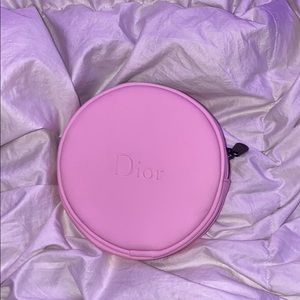 Baby pink Dior round cosmetics bag
